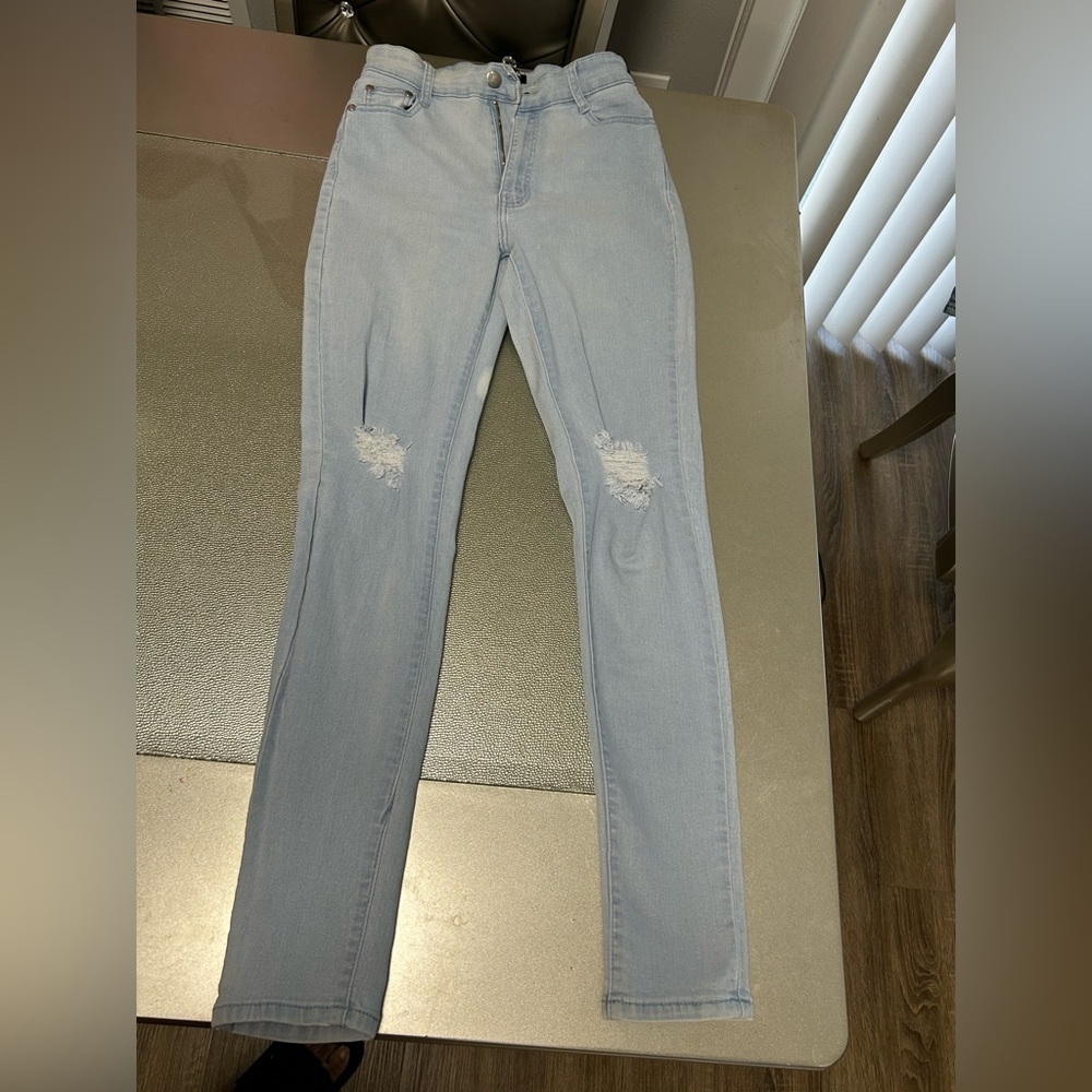 Light blue distressed jeans